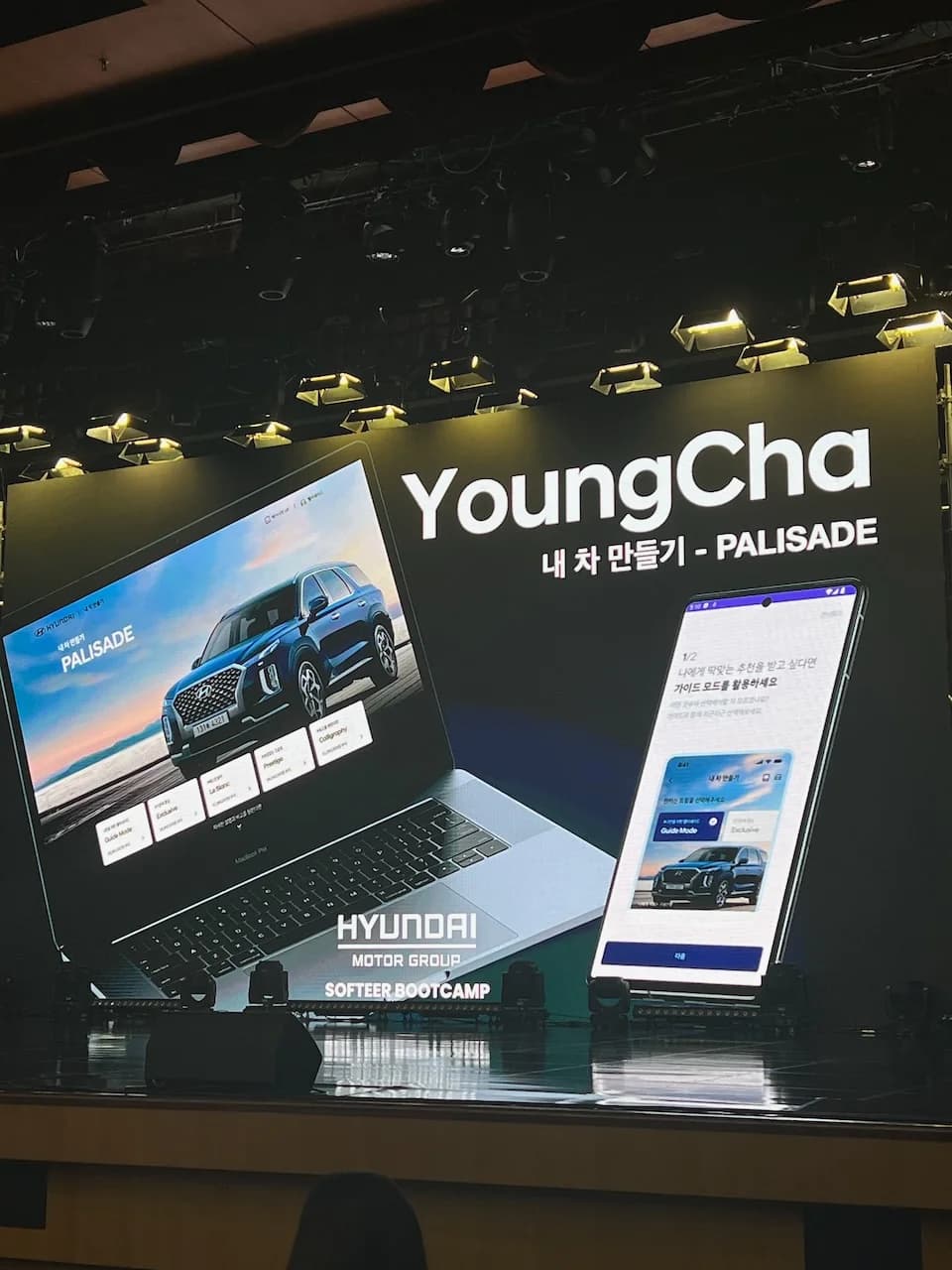 The final-presentation backdrop: the project branded YoungCha, with laptop and phone mockups